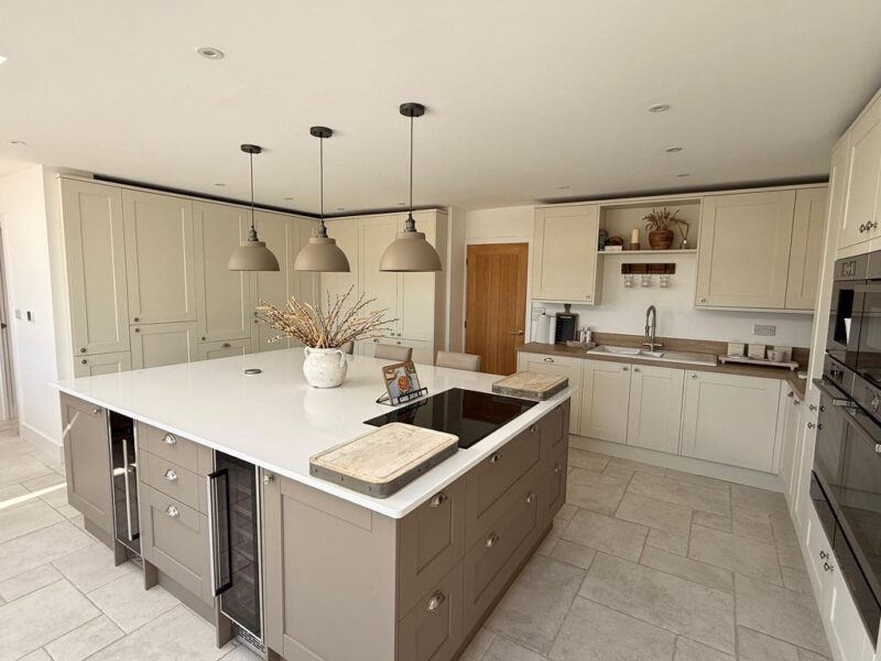 Modern cream kitchen with island and pendant lights