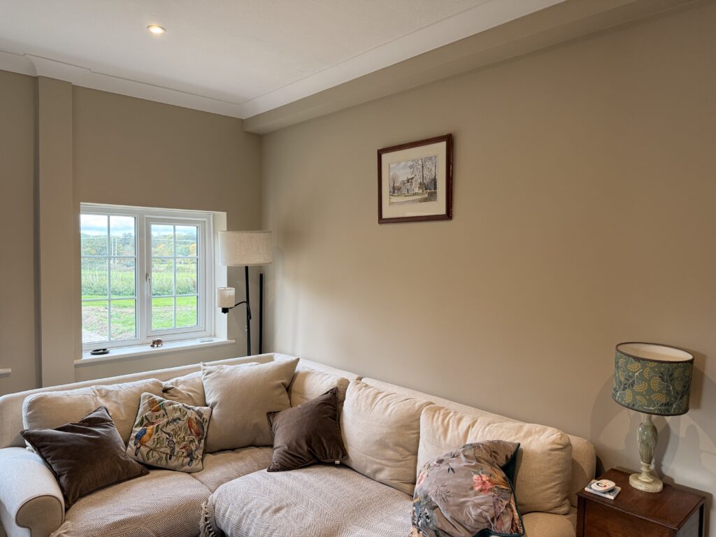 A freshly decorated living room with a countryside view